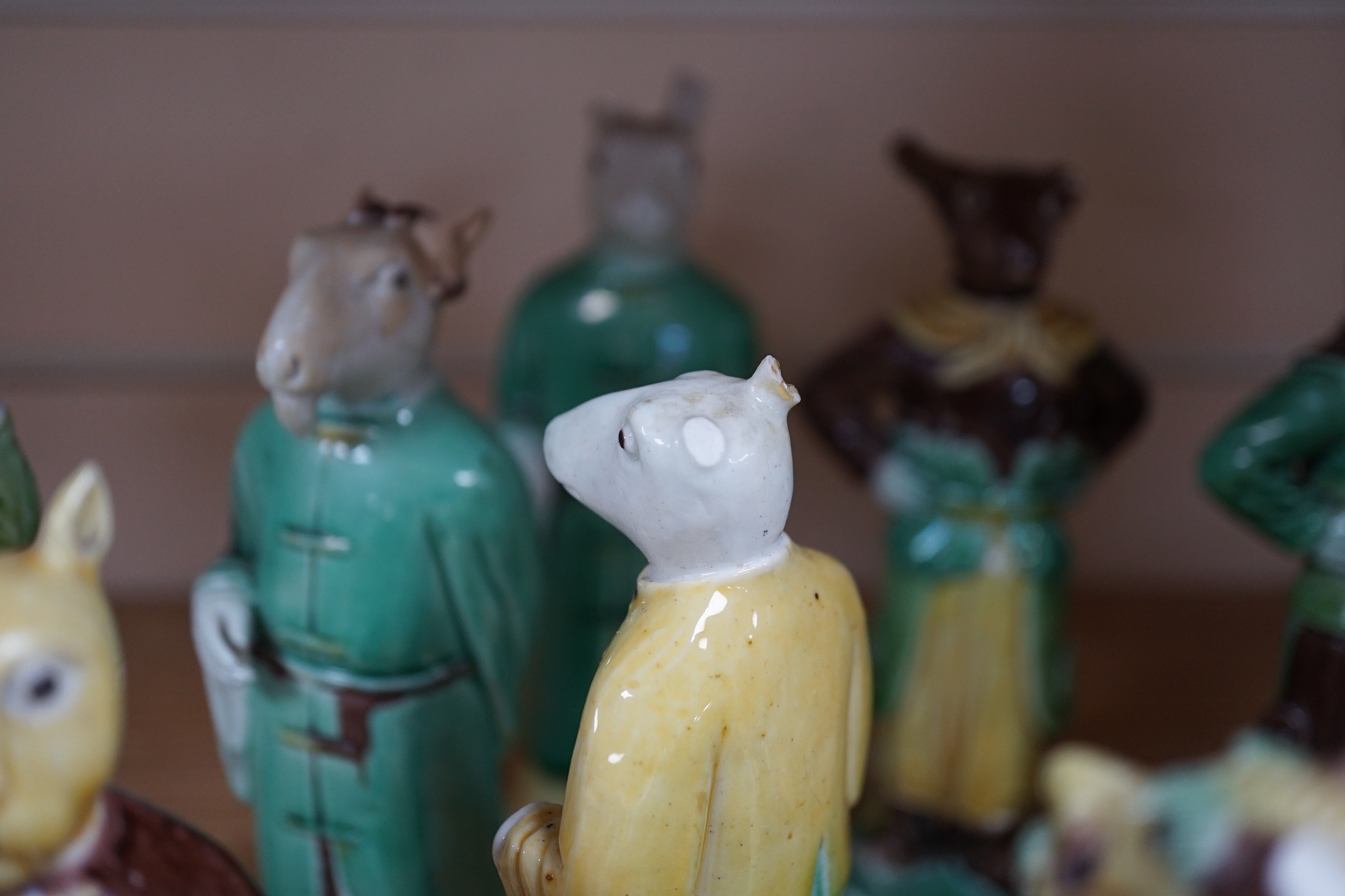 Ten Chinese Sancai glazed biscuit animal headed figures, tallest 17cm